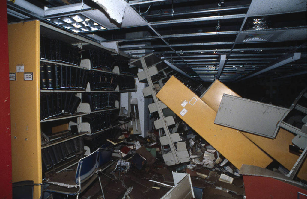 Toppled shelves in the Morgan Library after the flood