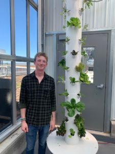 Oliver Fulton with the vertical aeroponic garden