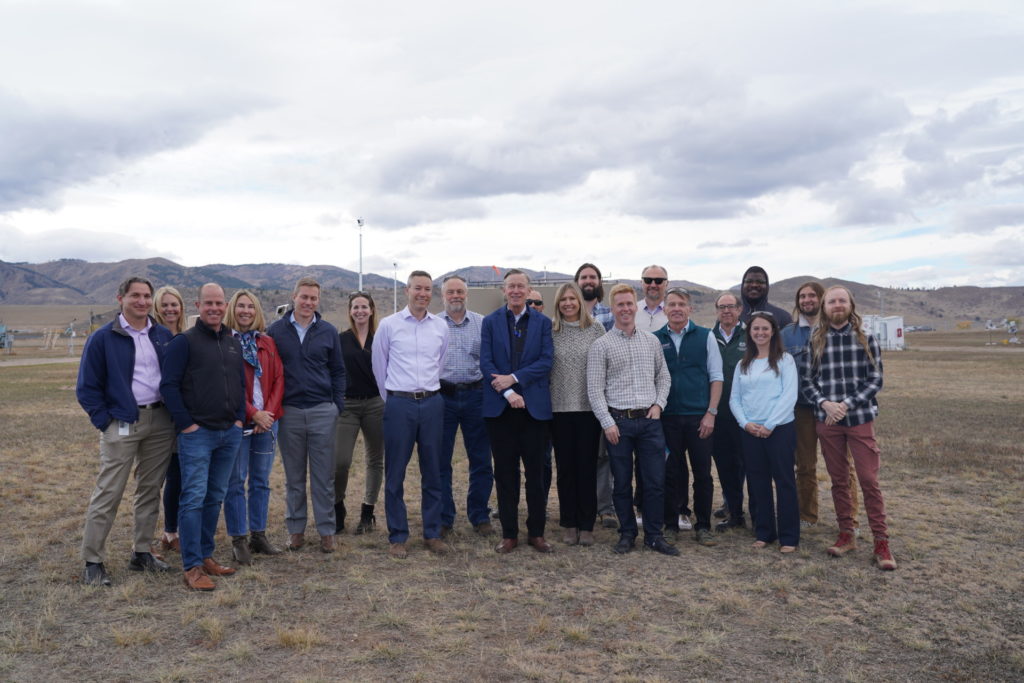 Hickenlooper poses with group at METEC