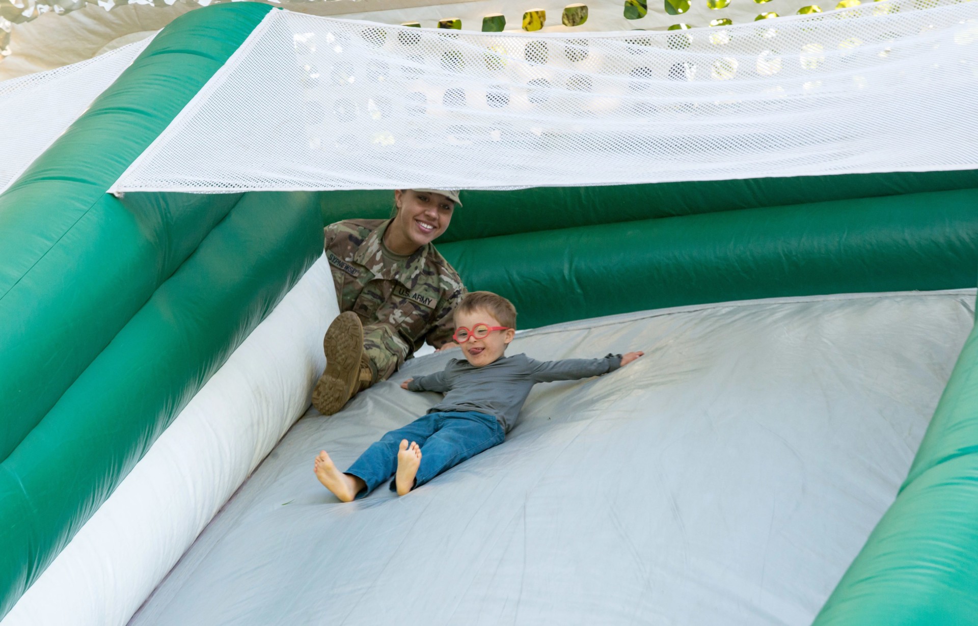 Child on inflatable slide