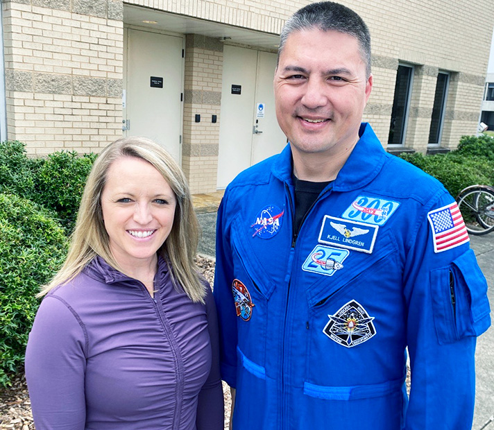Maj. Danielle Anderson and astronaut Kjell Lindgren outside of the Astronaut Gym after Lindgren finished reconditioning.