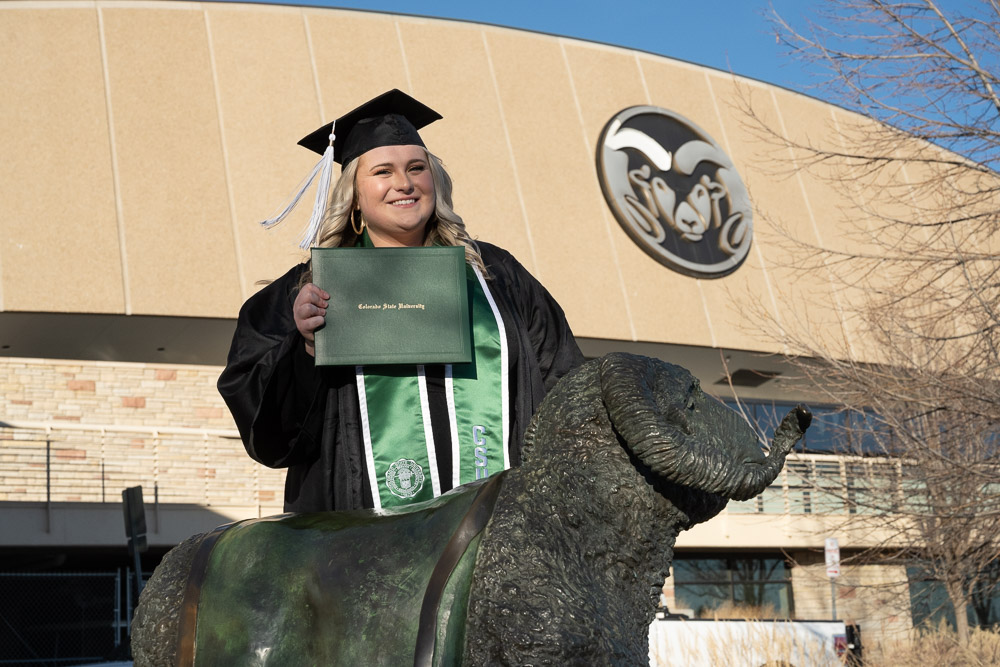Graduate in front of Moby