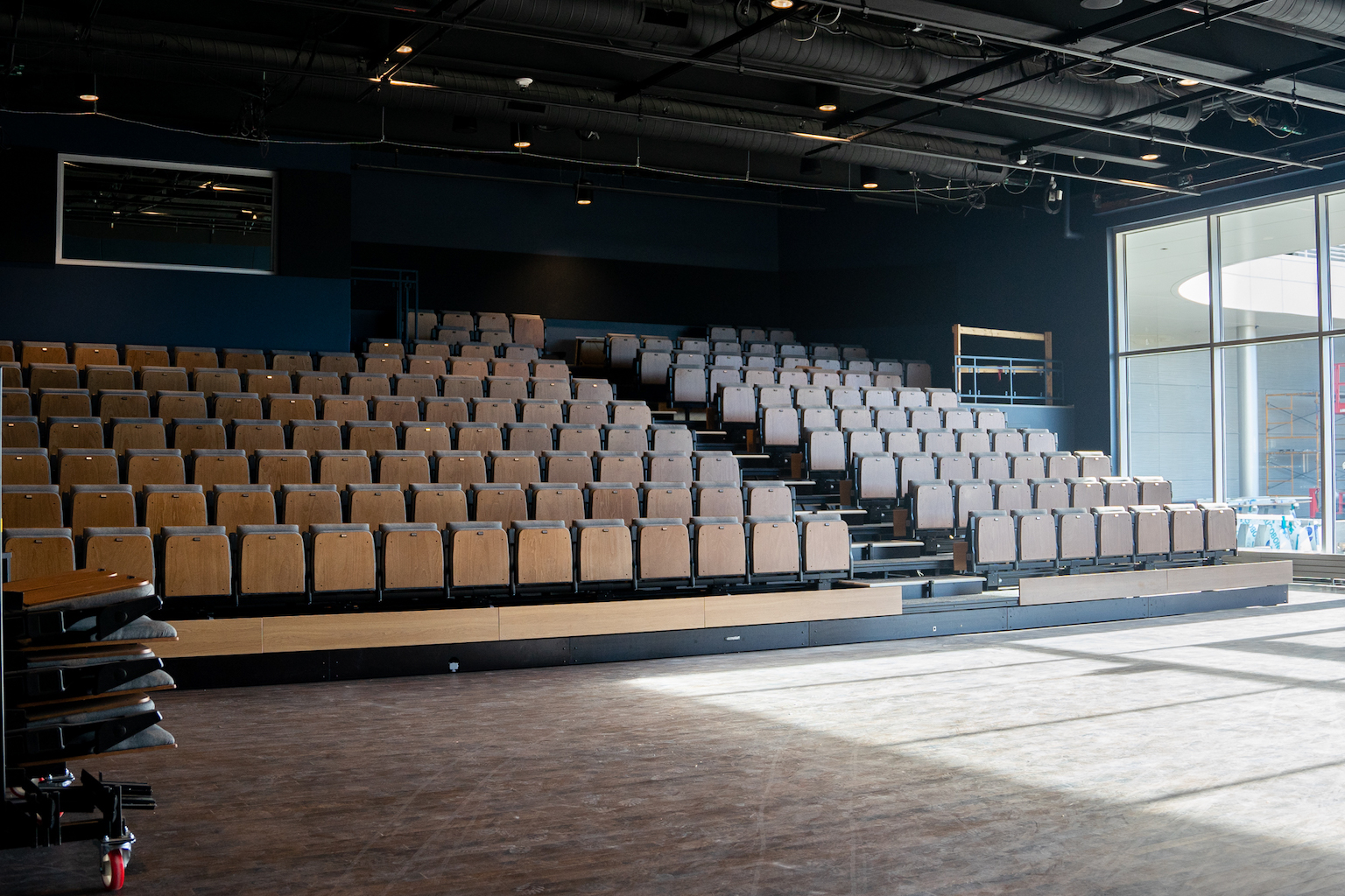 Theater space with stadium seating.
