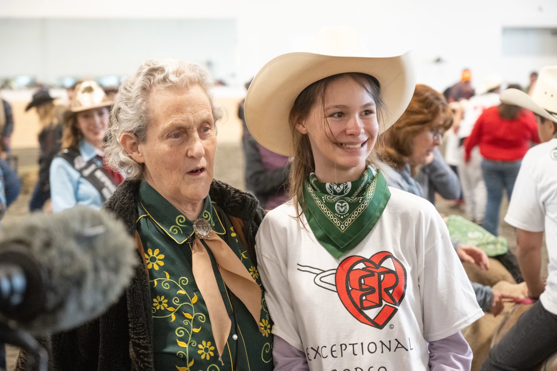 Temple Grandin with a kid at the Exceptional Rodeo
