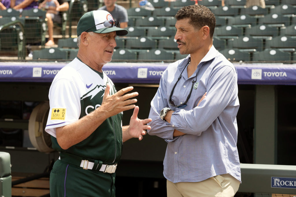 CSU football coach Jay Norvell chats with the Rockies manager.