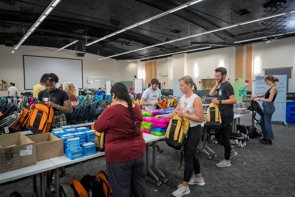 Colorado State University President Amy Parsons and Front Range Community College President Colleen Simpson, stop by School is Cool as volunteers to help fill backpacks in support of Poudre School District students. August 9, 2023