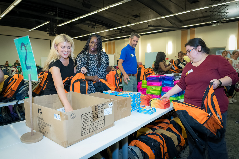 Colorado State University President Amy Parsons and Front Range Community College President Colleen Simpson, stop by School is Cool as volunteers to help fill backpacks in support of Poudre School District students. August 9, 2023