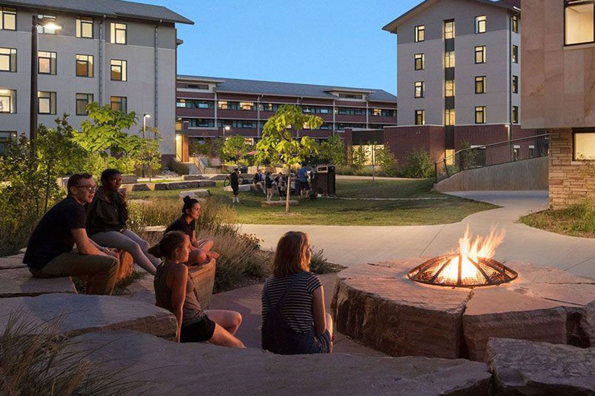 Students sitting around a fire pit at CSU