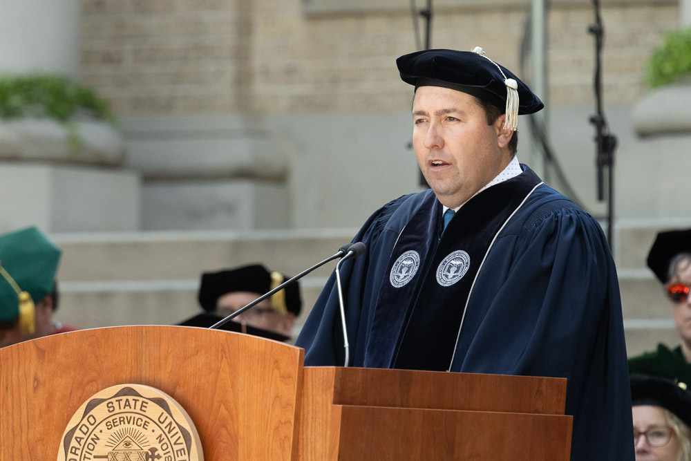 Armando Valdez, Chair of the Board of Governors, speaks at the 2023 Fall Address and Presidential Investiture Ceremony on the steps of the Administration Building. October 4, 2023