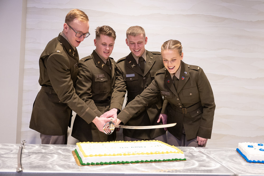 Commissioned officers cutting cake