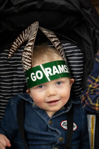A young boy wears Ram horns at the Stock Show