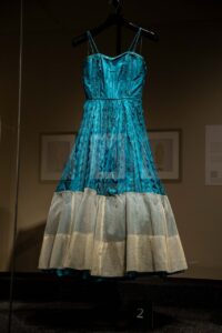 A long blue dress with tan bottom shown inside out is part of the Avenir Museum's Spring 2024 exhibition.