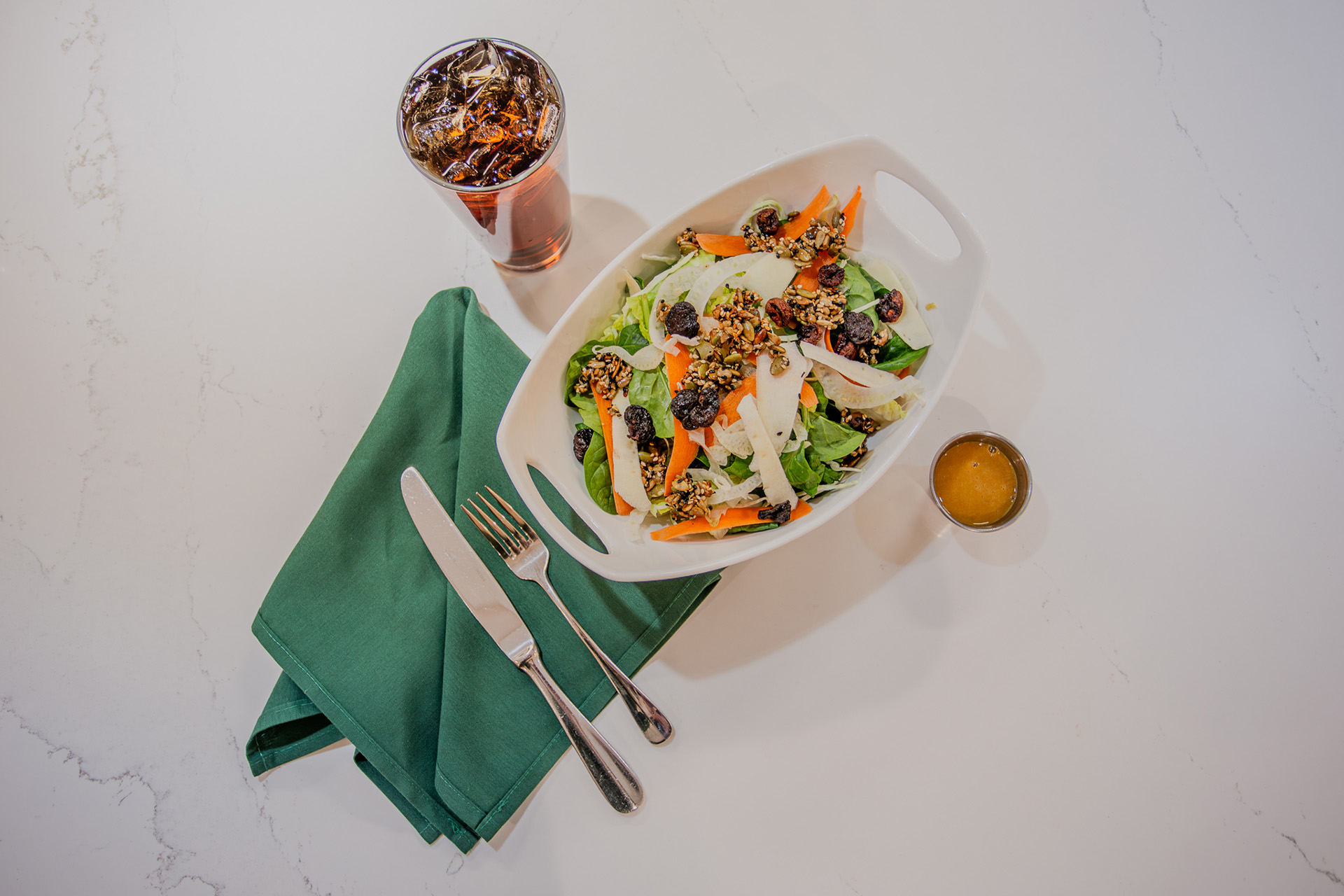 A fresh selection on the Aspen Grille’s new menu is the Crunch Salad, which features crisp greens and cabbage, a seed crunch mixture, shaved roots, and apple vinaigrette.