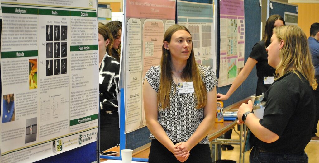 Student explaining research