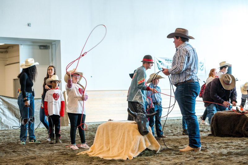 Kids practice with lassos at the Exceptional Rodeo